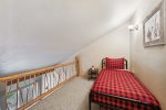 Take the stairs to basement level for additional bedroom and amenities